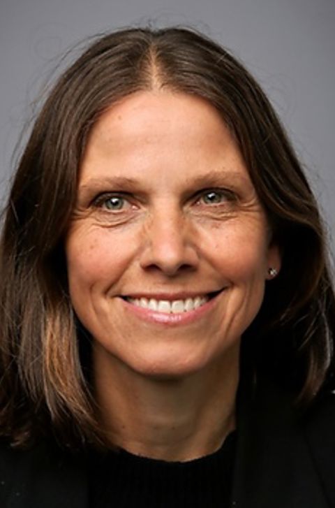 Et nærbilde av en person som smiler Et nærbilde av en person som smiler